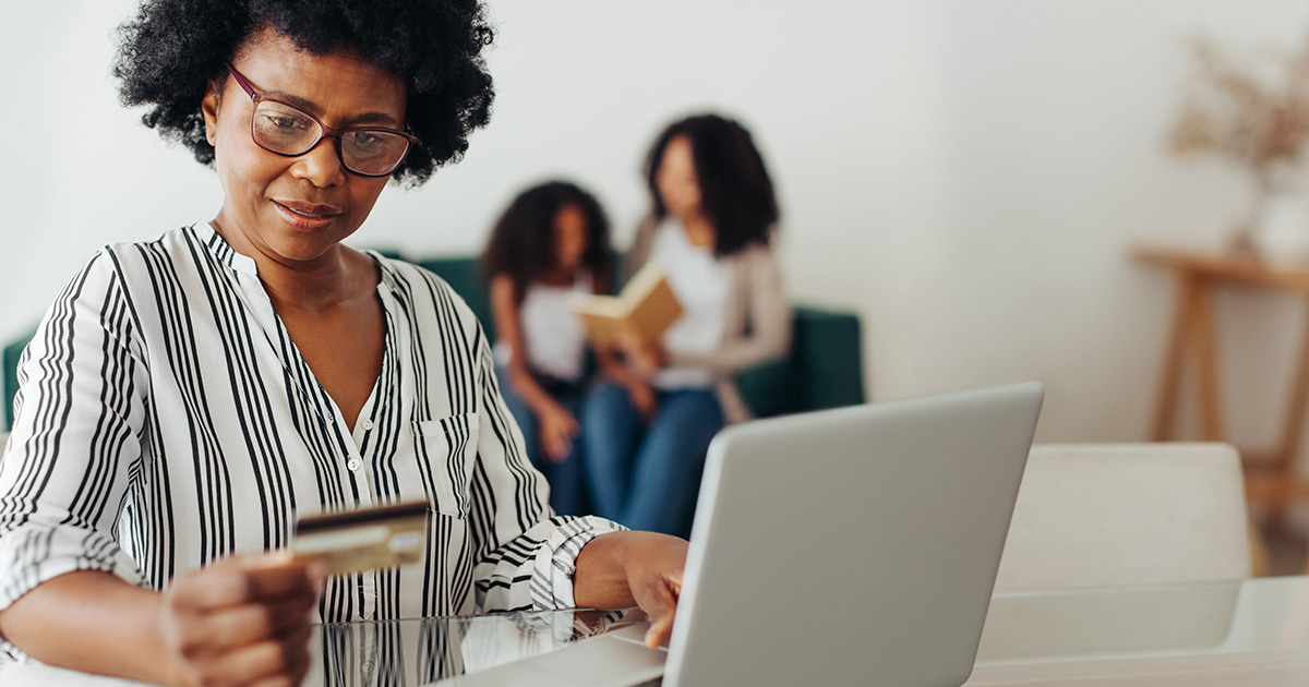 Person making an online payment using a credit card