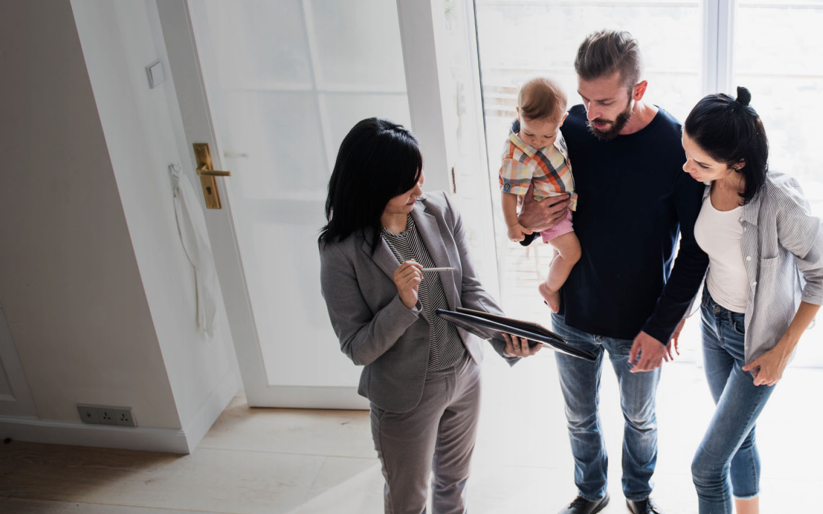 real estate agent discussing a home with a couple