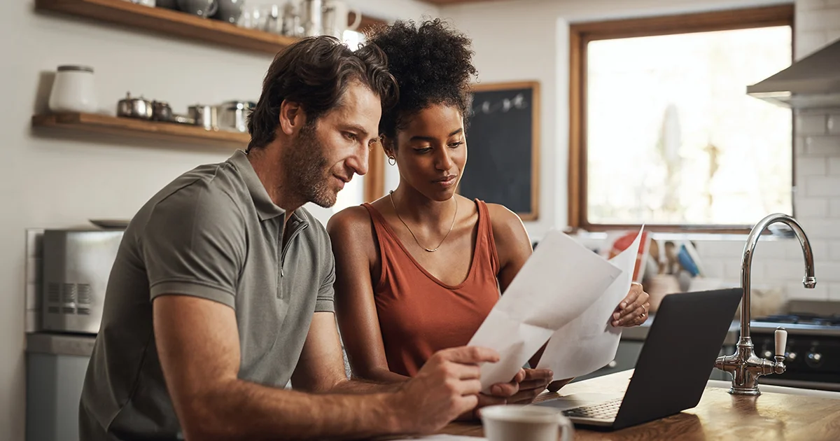 couple reviewing paperwork on counter