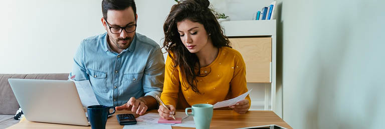 Man and Woman with documents over a table