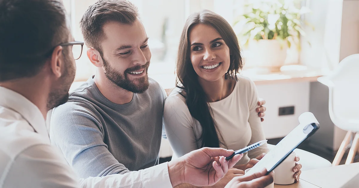 3 people reviewing financial documents