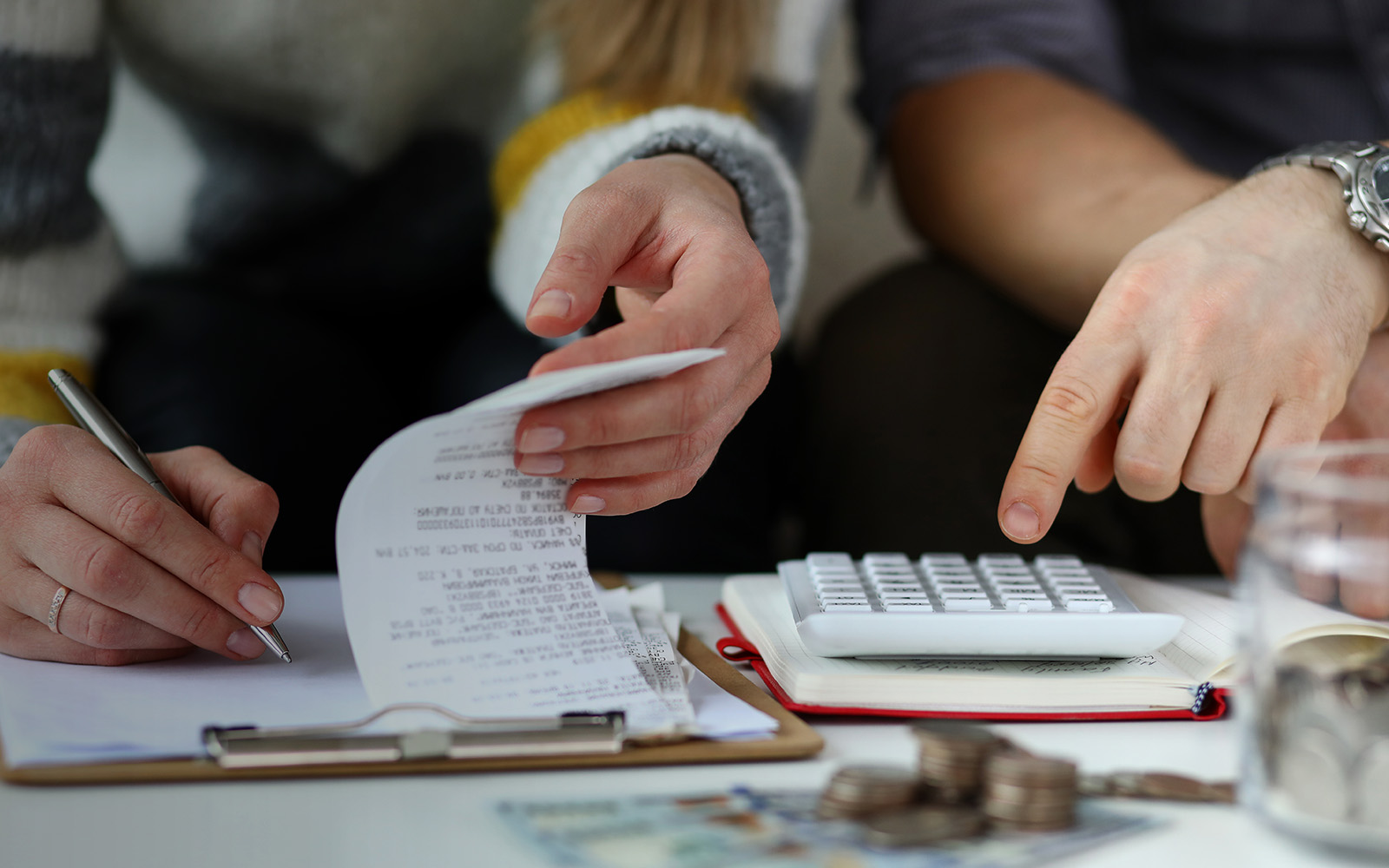 man and woman making account of family income 