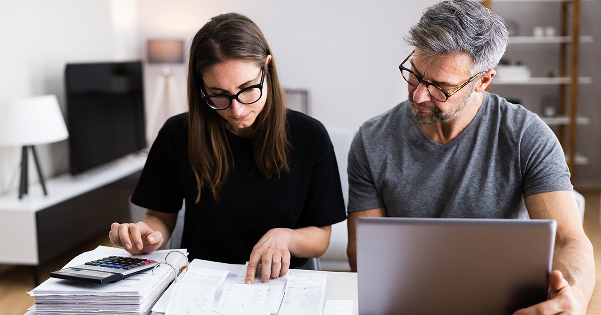 couple making the family budget together on a computer