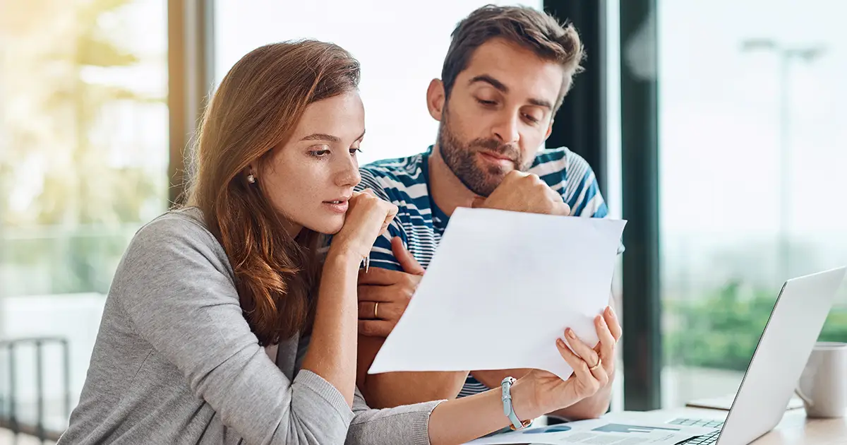 Couple looking over their household budget