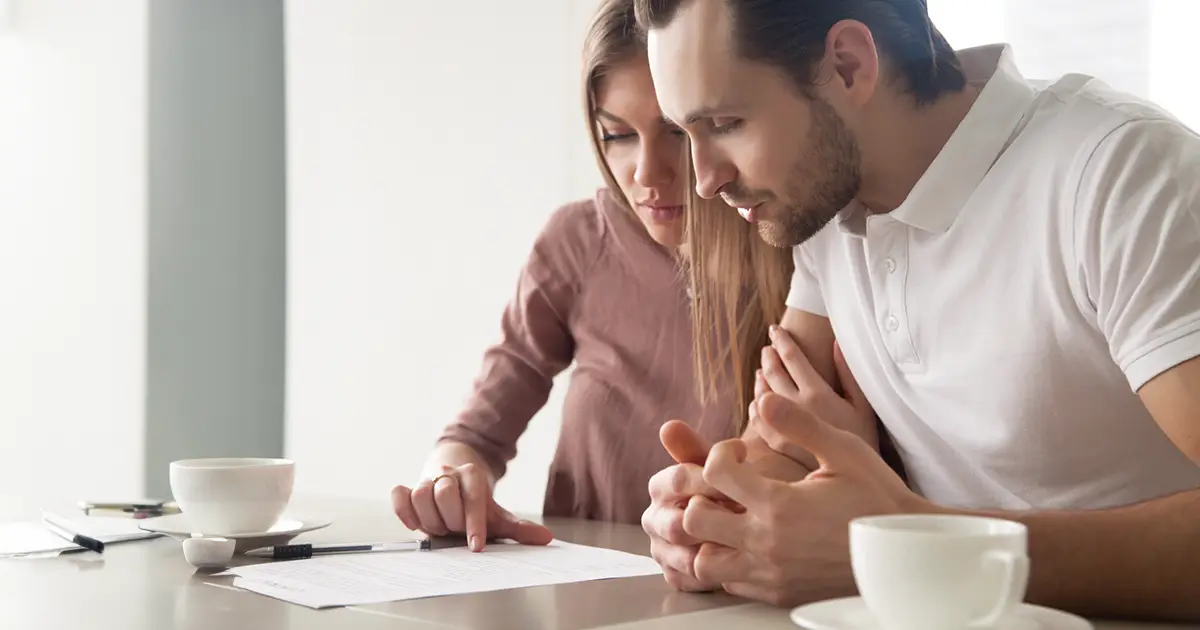 Husband and wife calculating domestic bills