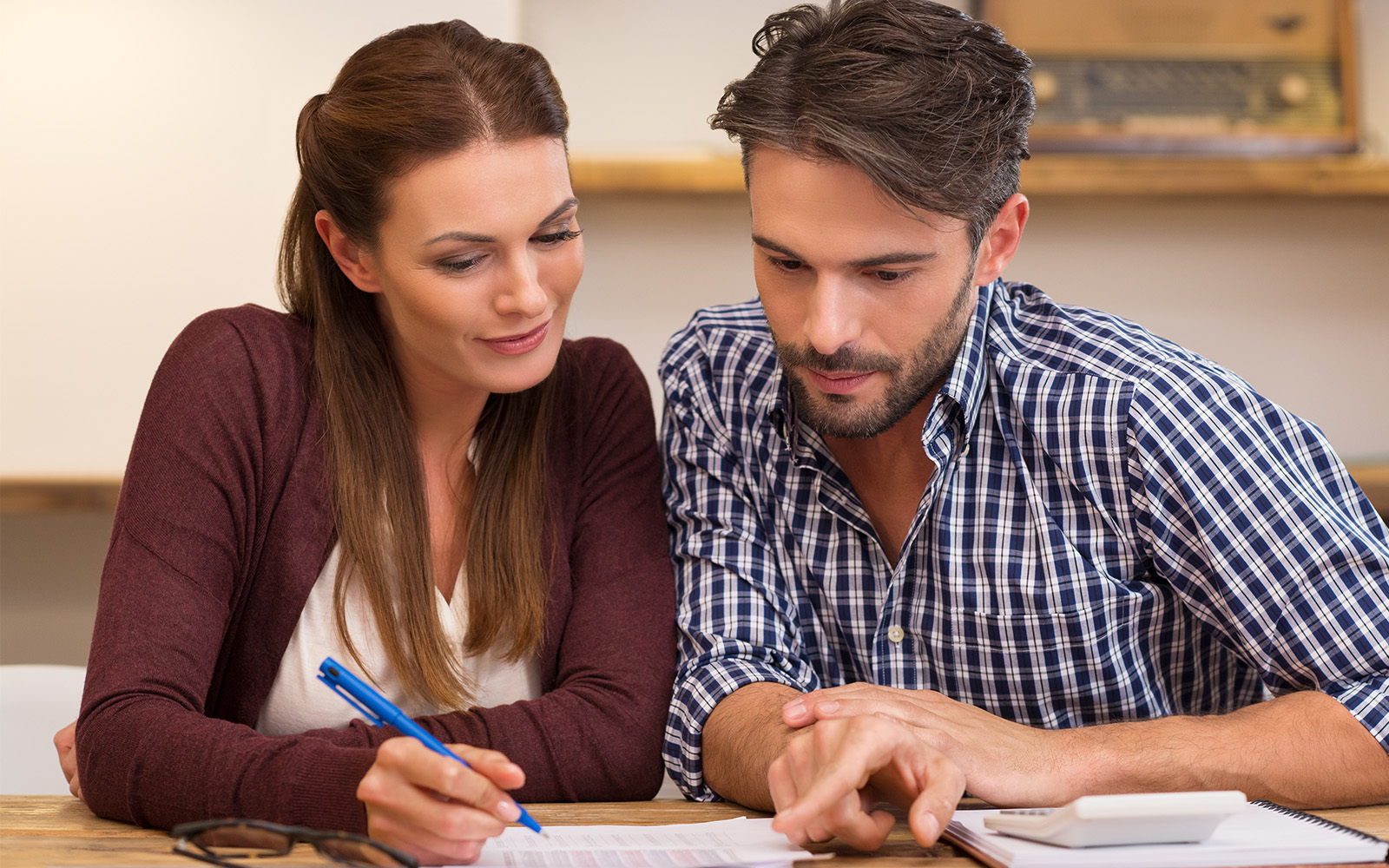 Two people filling a form