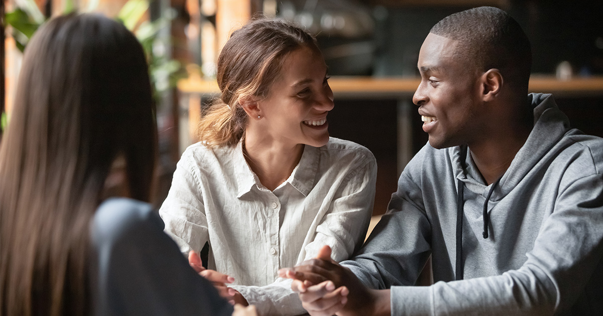 couple feel happy great sitting in cafe with mortgage professional