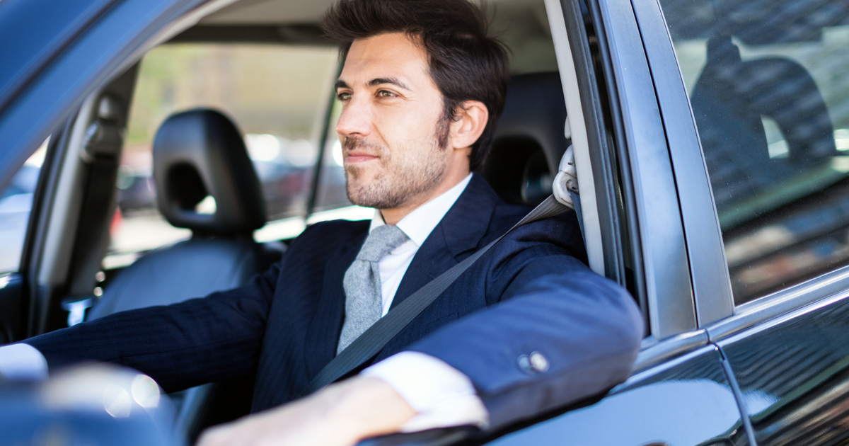 Thoughtful driver sits in his vehicle