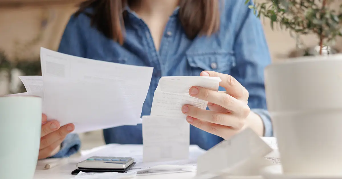 woman reading utility bills