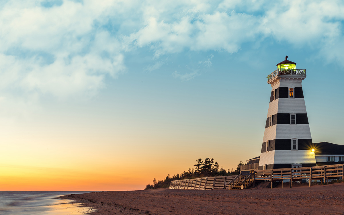 lighthouse in front of a sunset