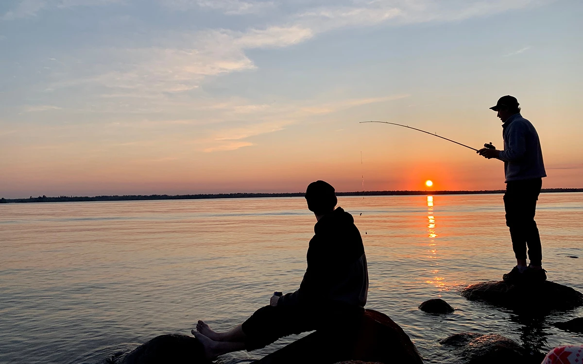 Two Manitobans fishing on a lake