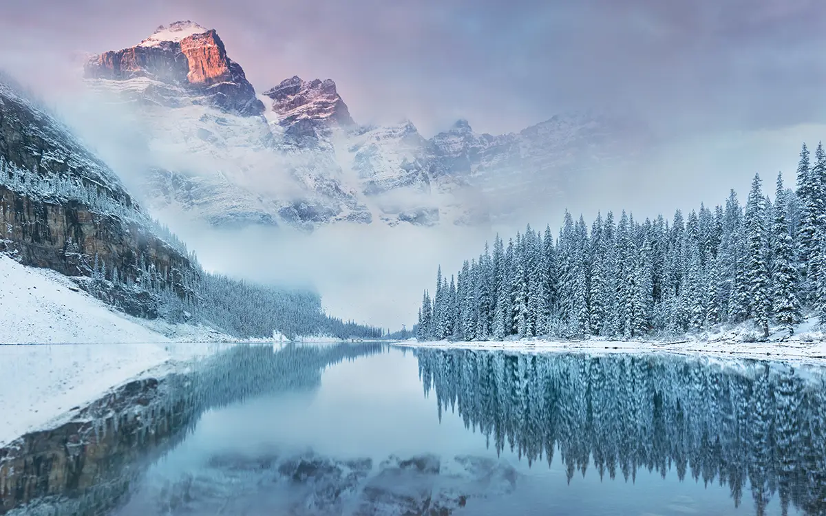 Snowy mountain behind a lake 