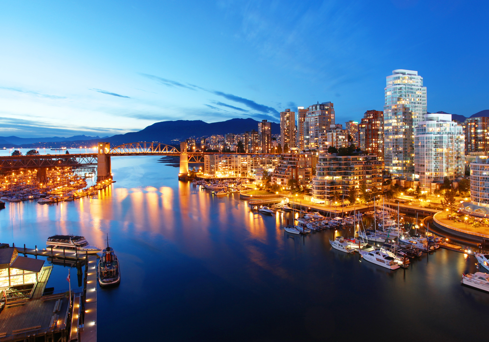 Night view of Vancouver port, downtown lighting up the streets and water