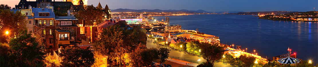 Coast lit up by street lights at night